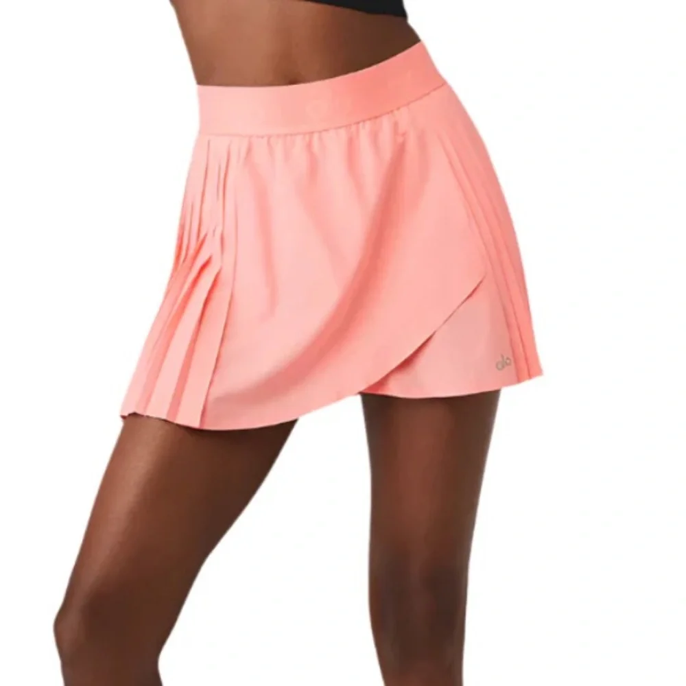ALO Yoga Pleated Mini Skort in Coral Pink